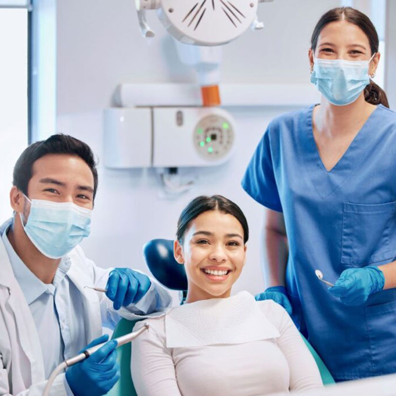 patient and doctors smiling